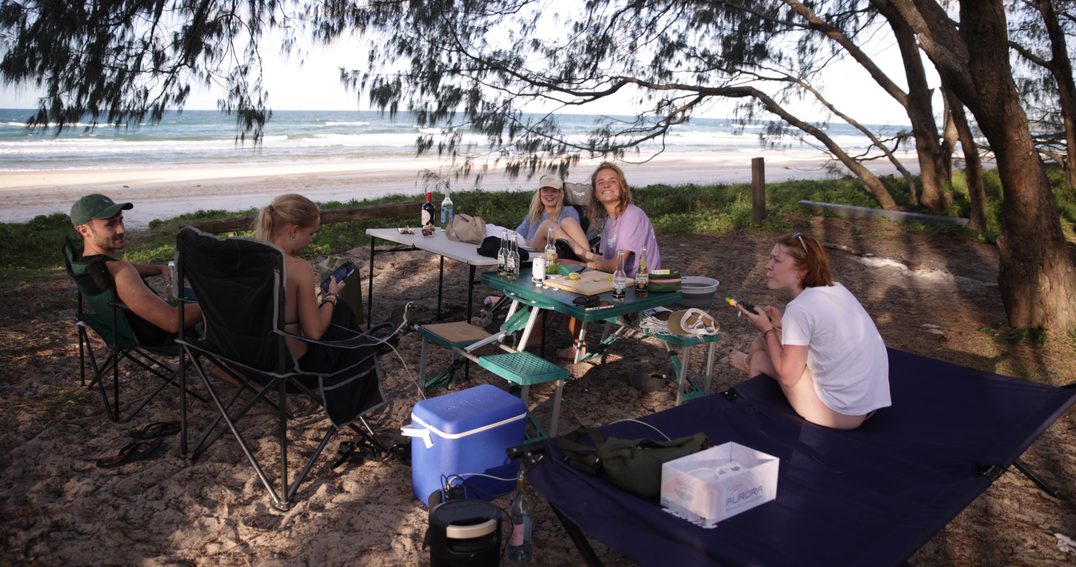 Group standing on dramatic layered rock shelf gazing out over bushland